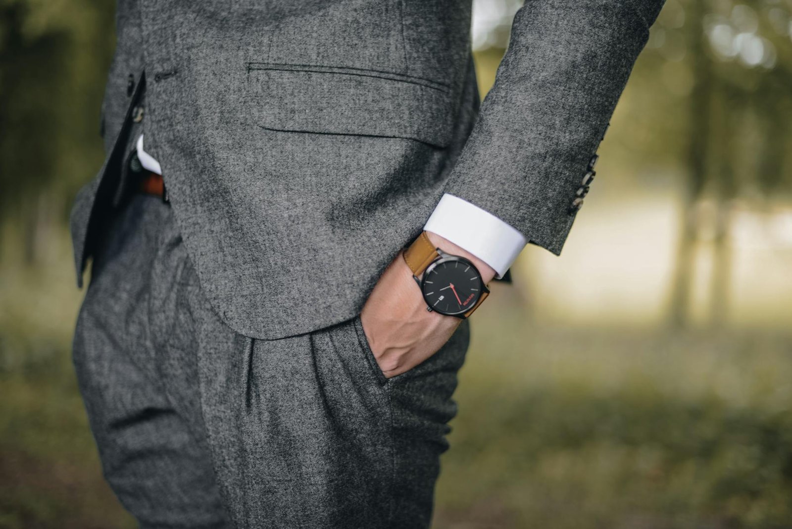 Old Money Fashion - General - man wearing watch with hand on pocket man wearing watch with hand on pocket