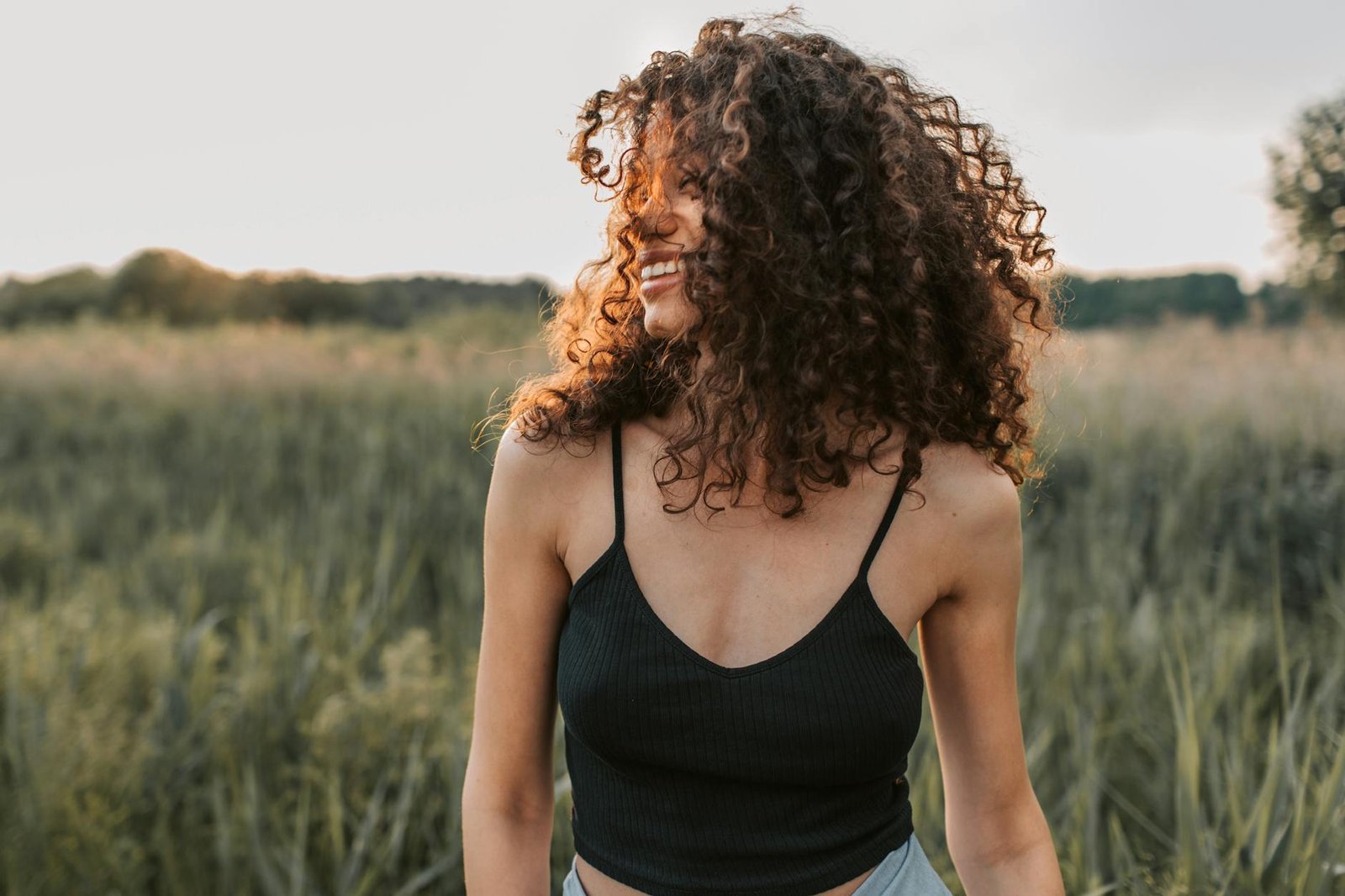 How To Get Curly Hair - General - photo of woman wearing black tank top photo of woman wearing black tank top