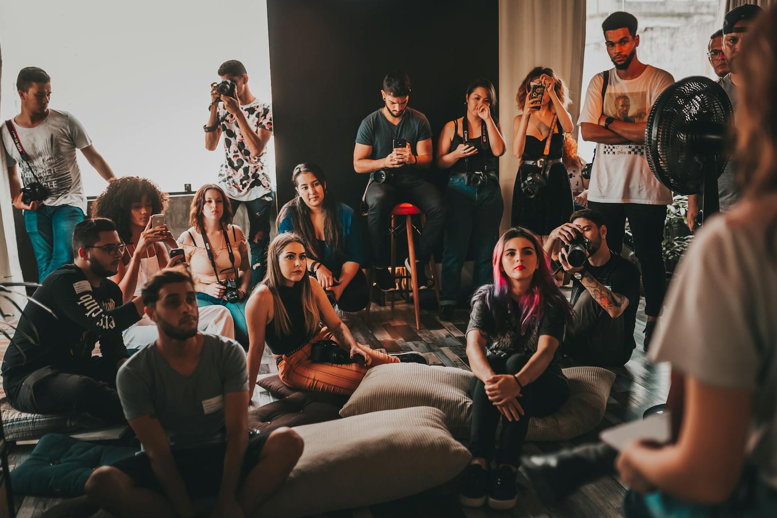 Mindfulness - Behavior - young diverse people gathering in studio and listening to speaker young diverse people gathering in studio and listening to speaker