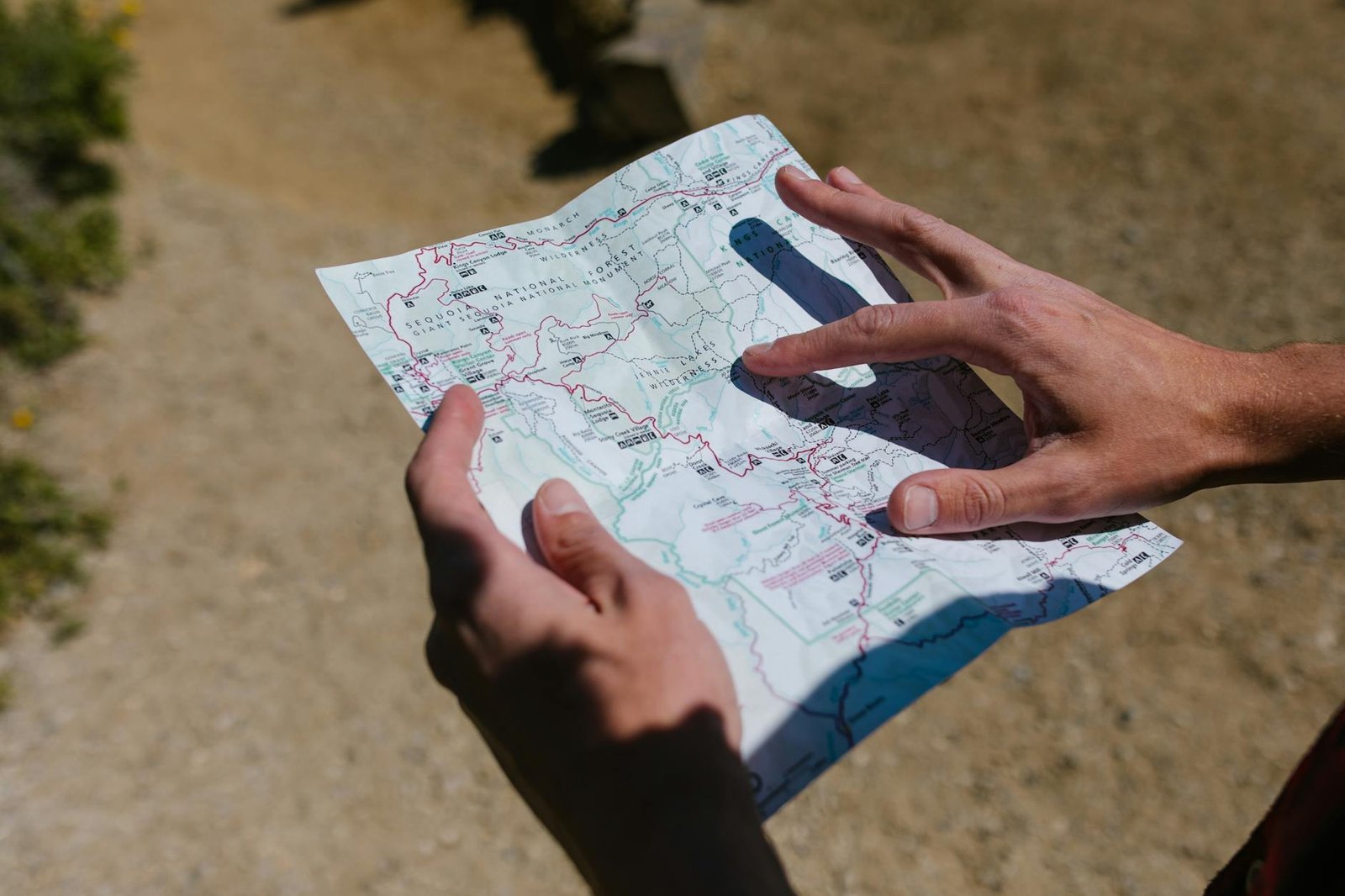 Secret Itineraries - Tourism - person holding white and red heart print paper person holding white and red heart print paper