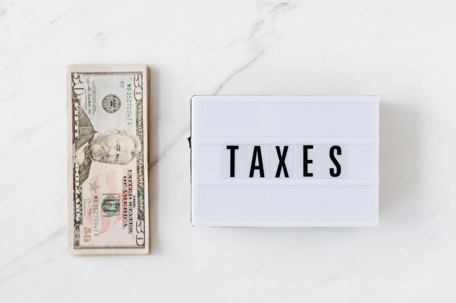Debt Management Services - Finance - american dollar bills and vintage light box with inscription american dollar bills and vintage light box with inscription